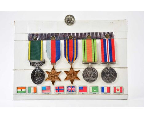 A medal group comprising of the War Medal, the Defence Medal, the Burma Star, the 1939-1945 Star, each unnamed, together with