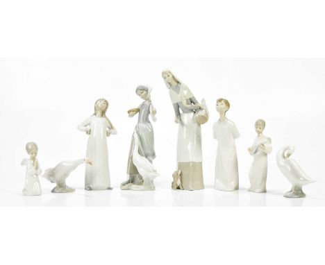 LLADRO; a collection of six ceramic figures and models including a girl holding a basket of bread with a puppy at her feet, h