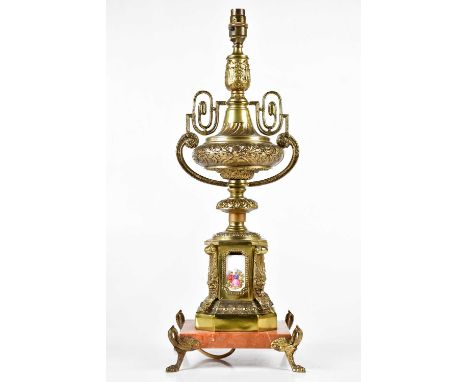 A gilt metal urn table lamp with enamel panels decorated with figures, height including fitting 58cm.