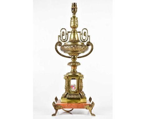 A gilt metal urn table lamp with enamel panels decorated with figures, height including fitting 58cm.