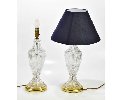 A pair of glass urn shaped table lamps, height including fitting 42cm.Condition Report: One of the lamps has two large chips 