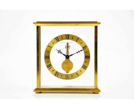 JAEGER-LECOULTRE; a gilt metal cased skeleton clock, the chapter ring set with Roman numerals, height 16.5cm, with applied pr