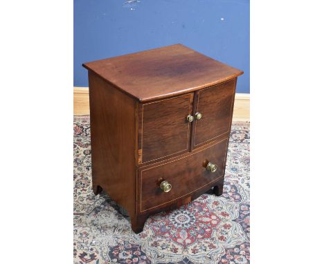 A 19th century inlaid mahogany two door converted commode with single base drawer on bracket feet, width 62cm, depth 51cm, he