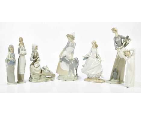 LLADRO; six figures including a water carrier, height 33cm, and a dancing girl, also two Nao figures (7).Condition Report: Th