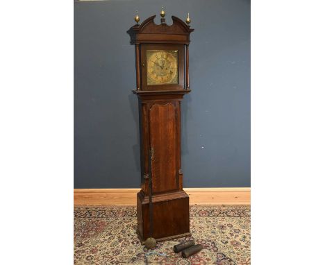 A George III oak and mahogany eight day longcase clock, with brass dial and movement striking on a bell, height 221cm.