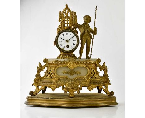 A late 19th century French ormolu and alabaster figural mantel clock representing a boy holding a fishing rod and fish, flank