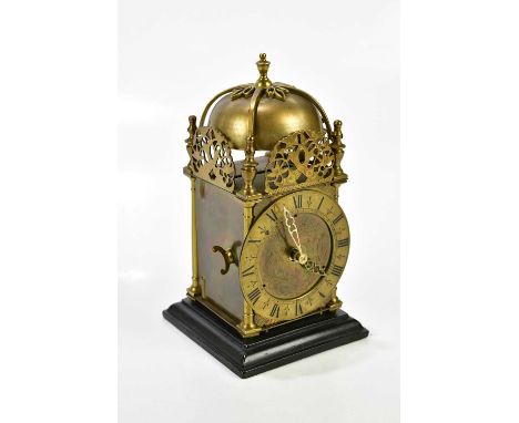 A reproduction lantern clock, the applied chapter ring bearing Roman numerals, the movement signed 'Daval', height 20cm.