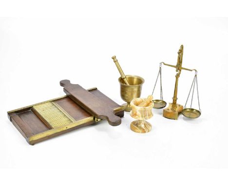 A late 19th century brass mounted pill maker, set of pharmacy scales with weights, and two pestles and mortars. 