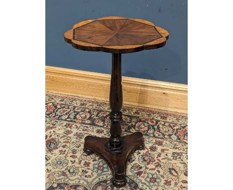 A 19th century mahogany and walnut occasional table with segmented top and pedestal base, height 73cm, diameter 42cm.