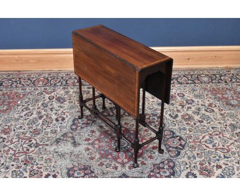 An Edwardian inlaid mahogany Sutherland table, height 70cm, width 71cm, depth 25cm.