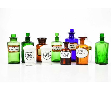 A collection of pharmaceutical jars including Victorian examples with glass labels, the blue example with dummy stopper 'SYR 
