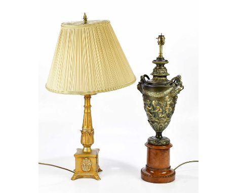 A modern decorative urn table lamp with mask handles, relief decorated with cherubs, height including fitting 66cm, and a fur