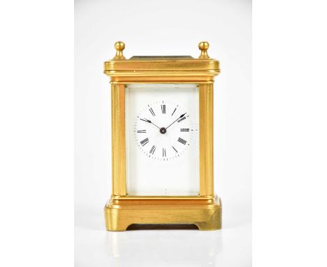 An early 20th century brass cased miniature carriage clock, the enamel dial set with Roman numerals, height 8cm.Condition Rep