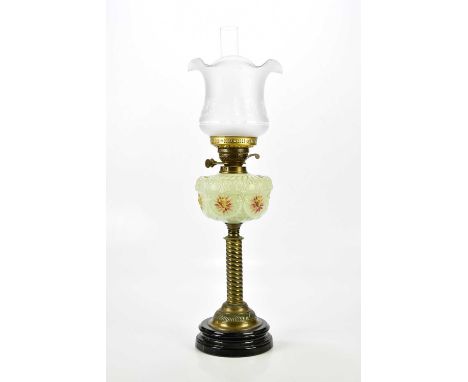 A Victorian oil lamp with associated frosted glass shade, the painted glass reservoir on turned brass column, overall height 