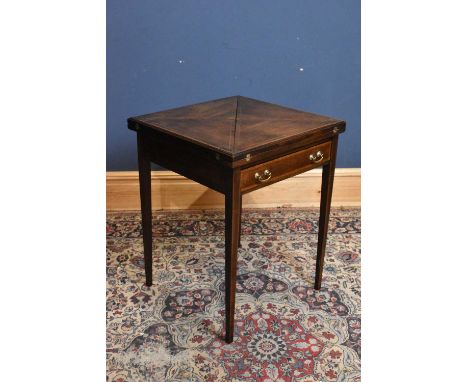 An Edwardian mahogany envelope card table, with drawer, height 71cm, width 56cm.