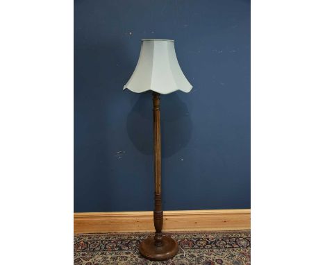 A beech standard lamp, height 154cm.