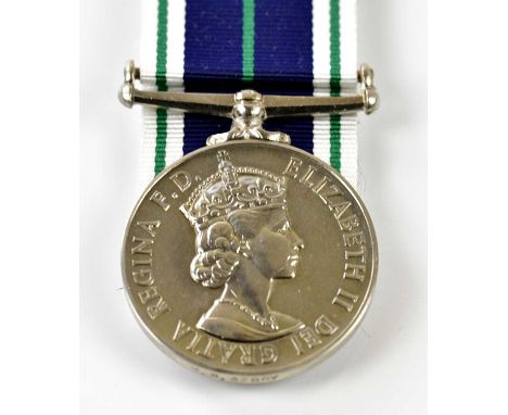 A Naval Auxiliary Service Long Service Medal, named to M. H. Berry.