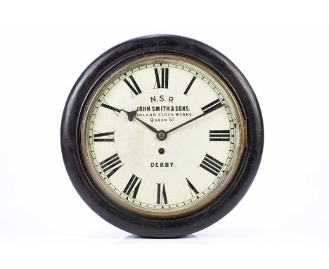 JOHN SMITH &amp; SONS OF DERBY; an ebonised Railway wall clock, white enamel dial initialled for North Staffordshire Railway,