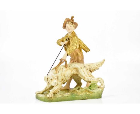 ROYAL DUX; a large and impressive figure of a boy walking a dog, height 45cm, length 37cm.Condition Report: Restoration to th