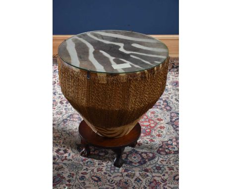 An unusual zebra skin and string set tapering drum/table raised on associated circular stand, diameter 61cm.