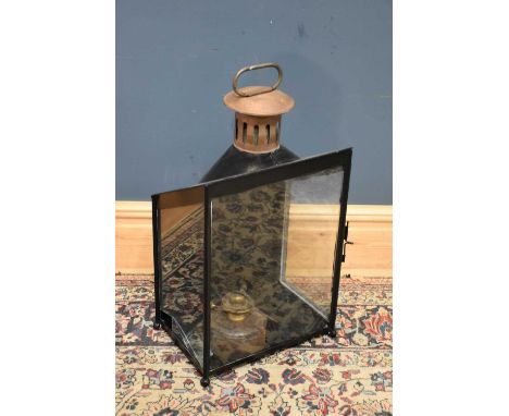 A black painted metal lantern, marked BR(M),