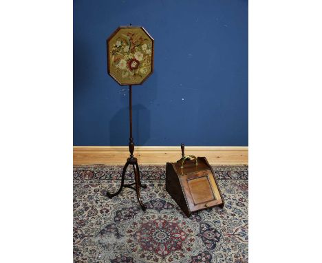 A 19th century pole screen with tapestry panel and a Victorian coal scuttle with shovel (2).   Condition Report: The coal scu