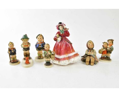 ROYAL DOULTON; a figure HN2110 'Christmas Time', and six Goebel figures (7). 