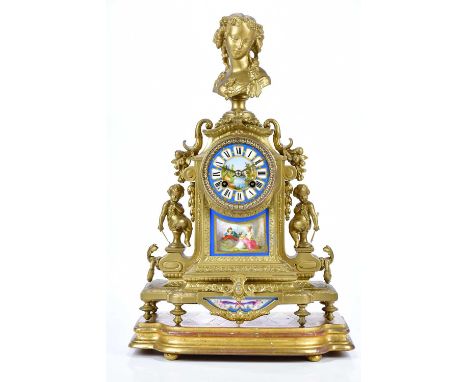 A 19th century gilt metal mantel clock, with bust finial side profile of a girl with flowing hair above the porcelain dial pa