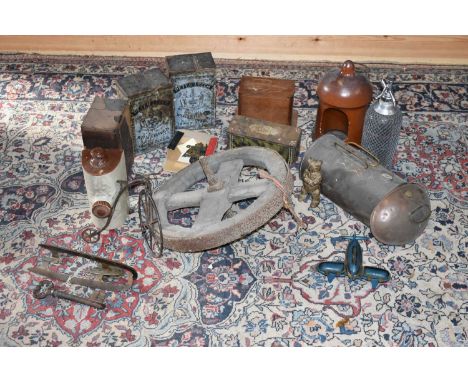 A collection of various collectors' items to include a terracotta lamp, an advertising tin, a model of a penny farthing and a