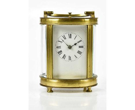 A French brass cased oval carriage clock with swan neck handle, the enamel dial set with Roman numerals, height 14cm.