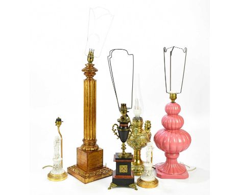 A collection of six lamps, to include a wood gilt Corinthian column example, a brass converted oil lamp, two porcelain cherub