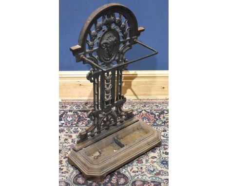 A cast iron stick stand, the base with canted corners, height 83cm.