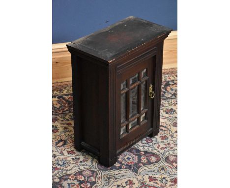 An Edwardian table top cabinet, with bevelled glass door, height 53cm, width 40cm.