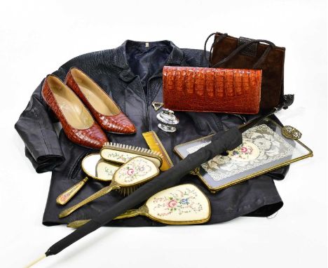 A crocodile skin handbag, together with matching shoes, a parasol, a further handbag, a faux leather jacket and a dressing ta