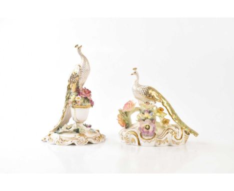 ROYAL CROWN DERBY; two hand painted porcelain models of peacocks with floral encrusted decoration, signed by Joan Lee, Jacky 