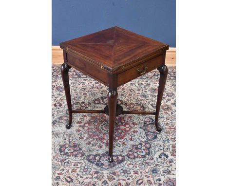 An Edwardian mahogany envelope card table, with single drawer, height 74cm, width 53cm, depth 53cm.