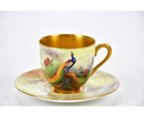 R AUSTIN FOR ROYAL WORCESTER; a hand painted coffee can and saucer decorated with pheasants in landscape.   Condition Report:
