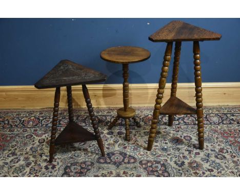 Two oak occasional tables with triangular tops, the larger example on bobbin supports, height 86cm, and an oak circular top t