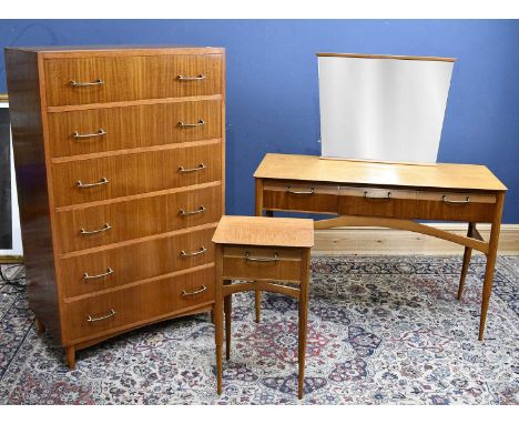 A retro style six drawer chest, together with dressing table and bedside cabinet, chest height 135cm, width 84cm, depth 46cm.