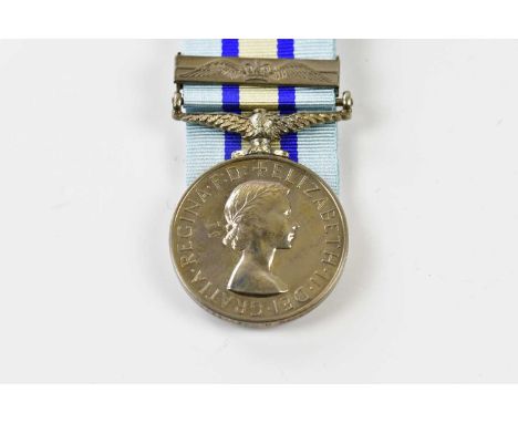 An Elizabeth II Royal Oberver Corps Medal, with second award clasp, with associated box, lapel pins and tie pin, named to Obe