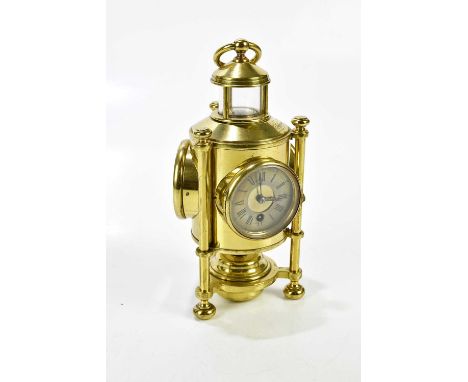 A 19th century brass cased lantern combination clock, the silvered dial set with Roman numerals and additional barometer/ther