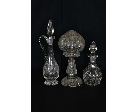 A cut glass mushroom lamp and shade, height 34cm, a cut glass claret jug and a cut glass decanter (3).