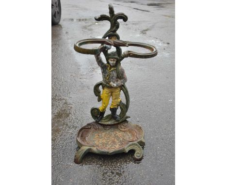 A cast iron painted figural stick stand, height 58cm.