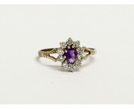 A 9ct gold and diamond ring stamped G. LTD. Size P. 1.65 grams. 