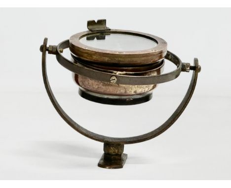An early 20th century Nautical Gimbal ships compass. Type 06 A. Stamped AM. 16x12x13cm 