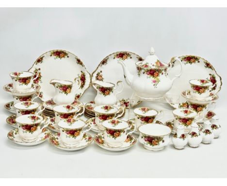 A 47 piece Royal Albert ‘Old Country Roses’ tea service. 2 pairs of salt and pepper shakers. A teapot 25x20cm. 2 milk jugs, s