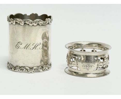 A George Nathan Ridley Hayes silver napkin ring with Irish shamrock decoration, 18.57 grams. A tall ornate sterling silver na