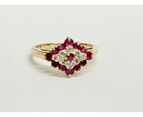 A 9ct gold and diamond ring with case. Size O. 