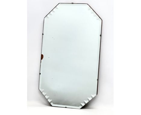 A 1930’s Art Deco bevelled mirror. 38x66.5cm 