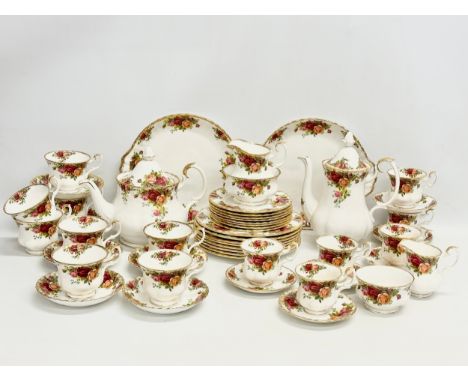 A large 50 piece Royal Albert ‘Old Country Roses’ tea and coffee service. 8 salad plates, 21cm. 8 sandwich plates. Coffee pot